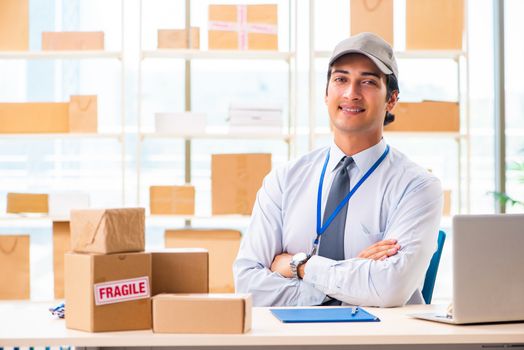 Male employee working in box delivery relocation service