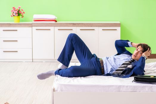 Young businessman employee late for office