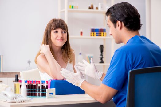 Young patient during blood test sampling procedure  