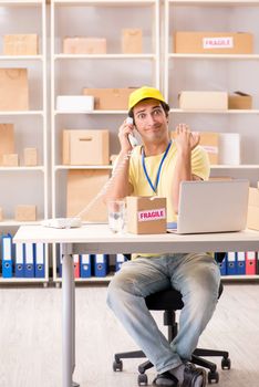 Handsome contractor working in box delivery relocation service 