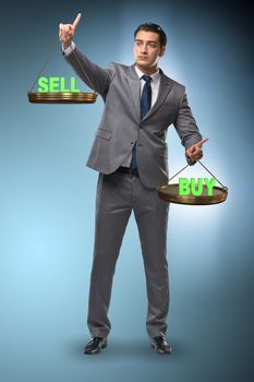 Businessman choosing between buying and selling