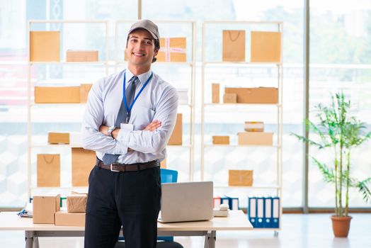 Male employee working in box delivery relocation service