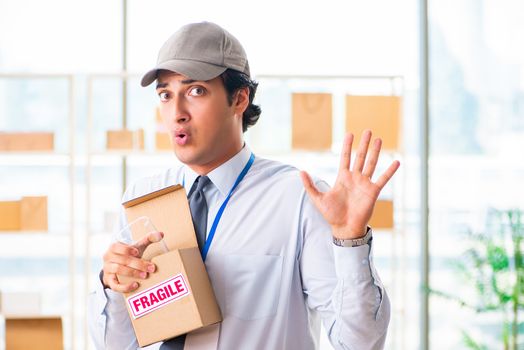 Male employee working in box delivery relocation service