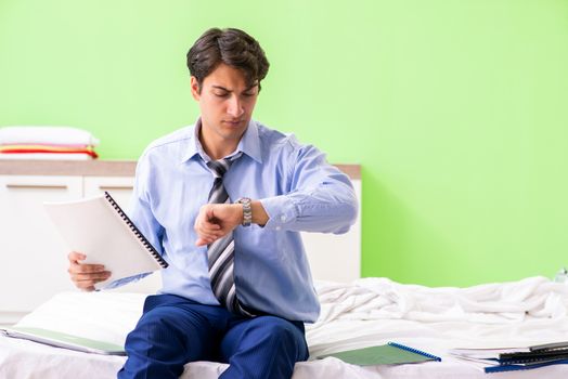 Young businessman employee late for office