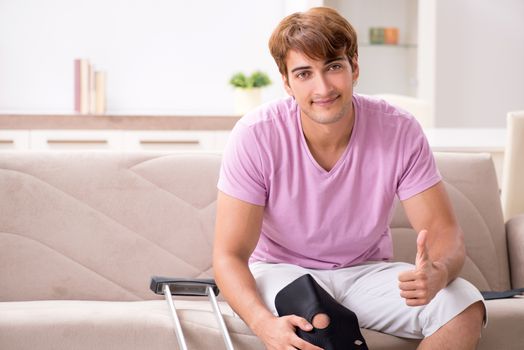 Injured man recovering at home from sports injury