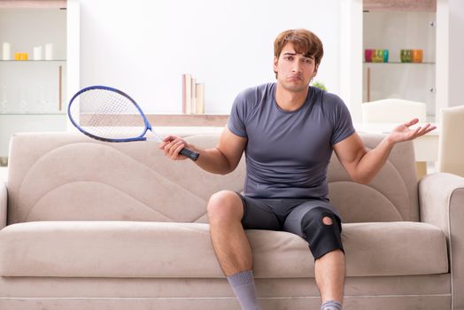Injured man recovering at home from sports injury