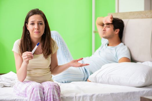 Young married woman with pregnancy results test