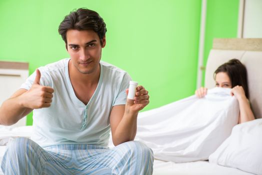 Man using pills for woman satisfaction  