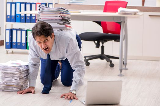 Extremely busy employee working in the office