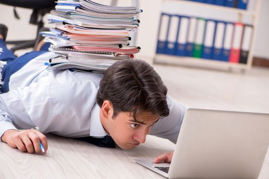 Extremely busy employee working in the office