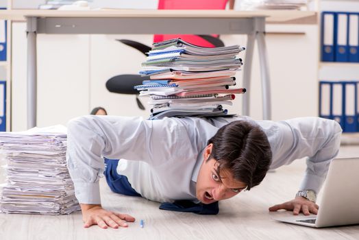 Extremely busy employee working in the office