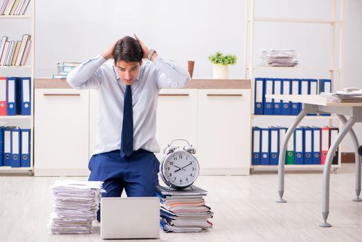 Extremely busy employee working in the office