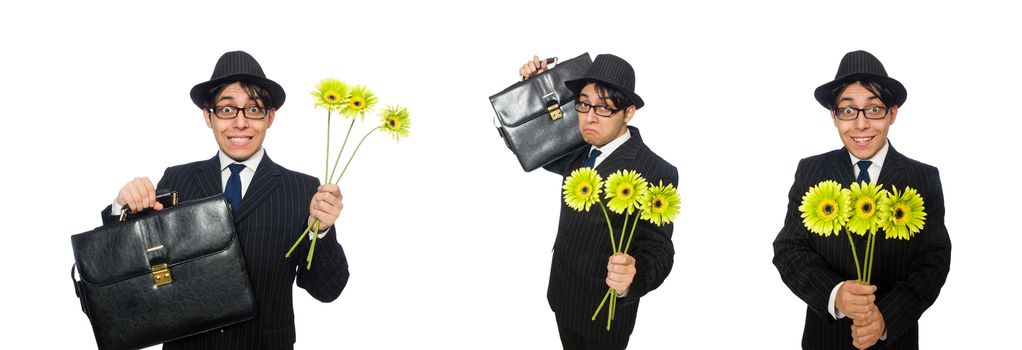 Young man in black costume with flower isolated on white