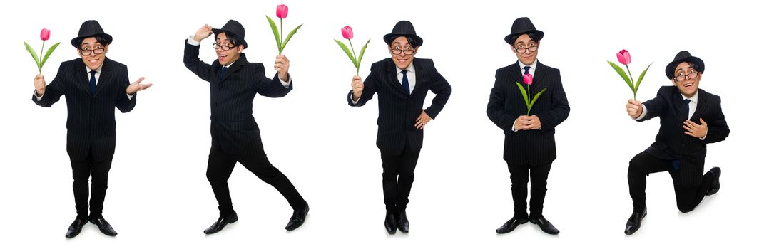 Young man in black costume with flower isolated on white