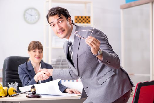 Man and woman discussing construction project