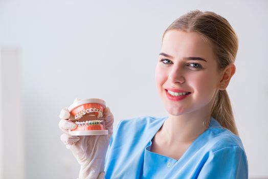 Young doctor nurse with dentures