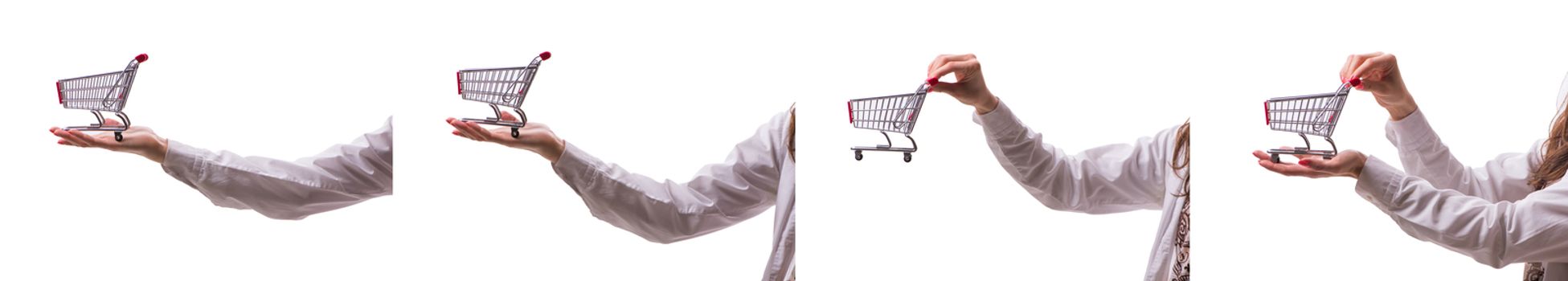 Hand holding shopping cart isolated on white