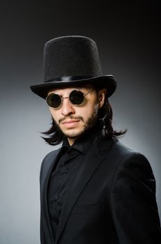 Vintage concept with man wearing black top hat