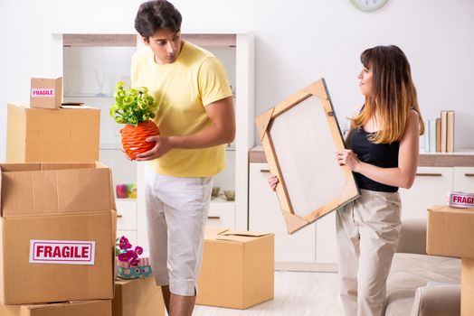 Young pair moving to new flat with fragile things 