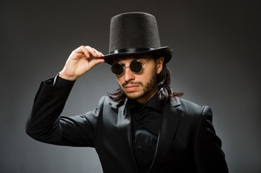 Vintage concept with man wearing black top hat