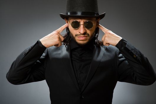 Vintage concept with man wearing black top hat