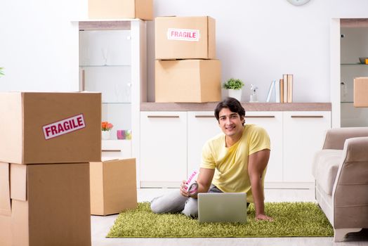 Man moving house and relocating with fragile items