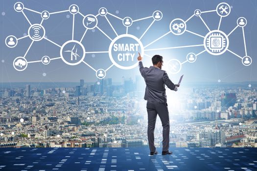 Concept of smart city with businessman pressing buttons