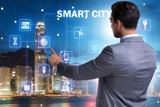 Concept of smart city with businessman pressing buttons