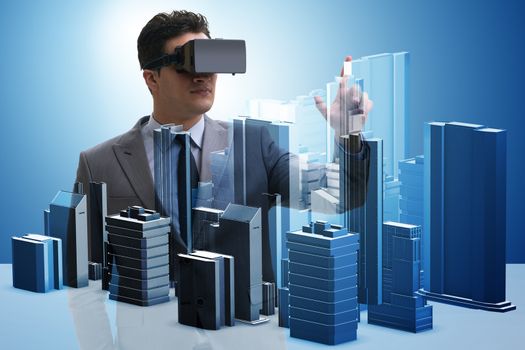 Man with virtual reality goggles doing urban planning