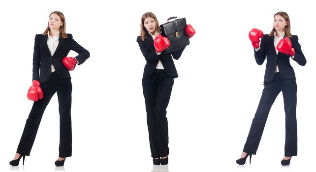 Businesswoman with boxing gloves isolated on white