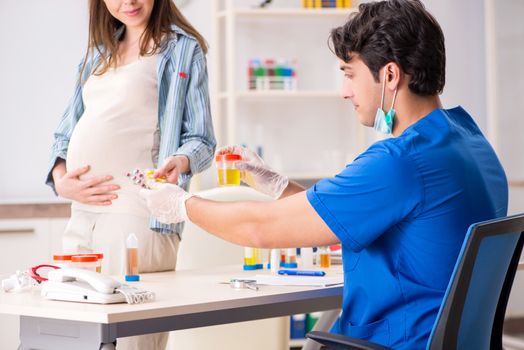 Pregnant woman visiting doctor for check-up