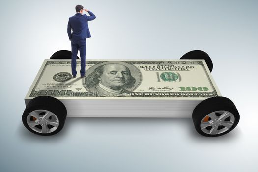 Businessman in the business concept with dollar car