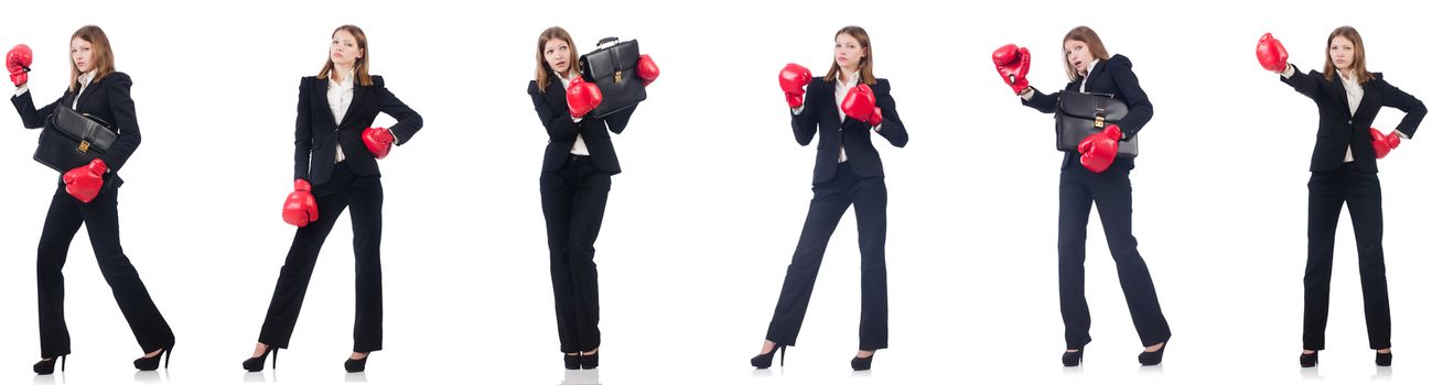 Businesswoman with boxing gloves isolated on white