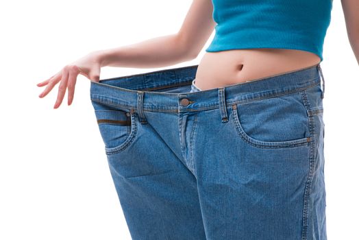 Concept of dieting with oversized jeans