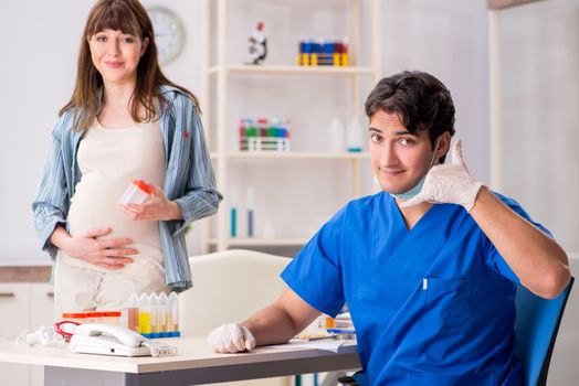 Pregnant woman visiting doctor for check-up