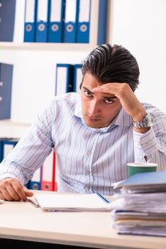 Young employee sitting at the office 