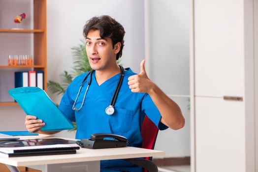 Young handsome doctor radiologyst working in clinic 