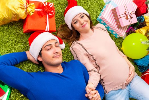 Pregnant wife celevrating christmas with husband