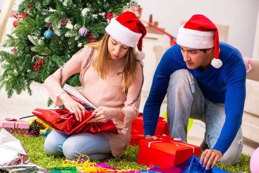 Pregnant wife celevrating christmas with husband