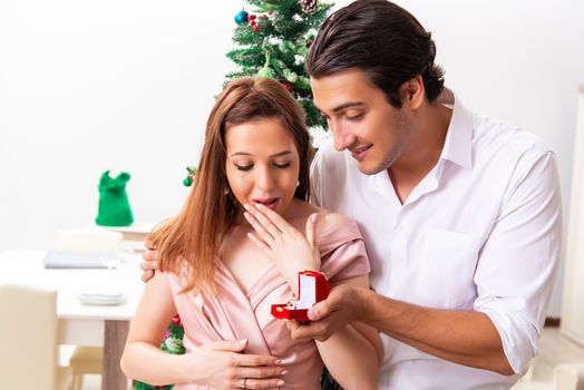 Man making marriage proposal at christmas day