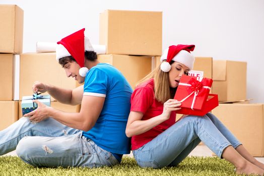 Young family celebrating christmas in new home