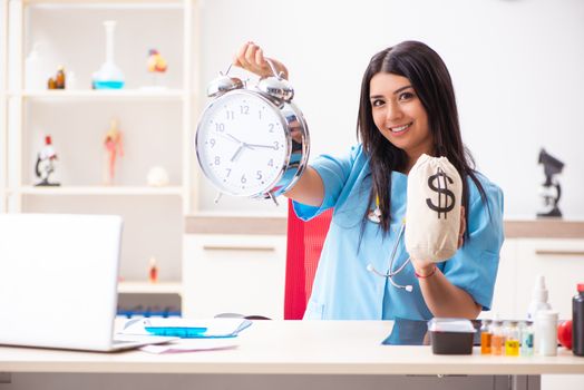 Young beautiful female doctor working in the clinic 