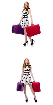 Beautiful woman in polka dot dress with suitcases isolated on white