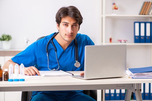 Young doctor working in the hospital