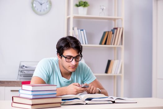 Young handsome student preparing for school exams