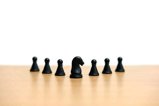 Business strategy conceptual photo - black horse knight in the middle of chess piece