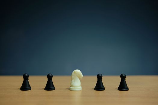 Business strategy conceptual photo - horse knight in the middle of chess piece