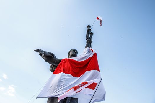 Belarus protest. Victory sculpture and the white red white flag