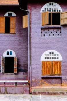 side view of classical brick British style building architecture in Nan province, Thailand