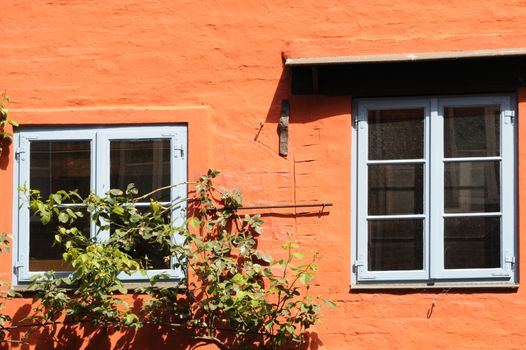 Orange wall of a house in Lueneburg, Lower Saxony, Germany.